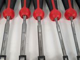 six red and black screwdrivers are lined up on a white surface