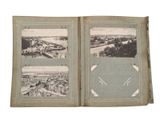 an old photo of a book with pictures of a city and a river