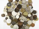 a pile of coins on a white surface