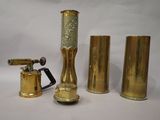 three different types of brass objects on a white background