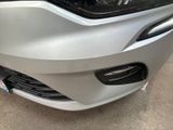 a close up of a car ' s front bumper