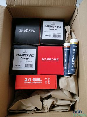 boxes of energy gels and batteries in a cardboard box