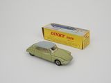 dinky toy car with box and box on white surface