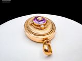 an image of a gold and amethorate pendant