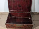 an old wooden trunk sitting on the floor