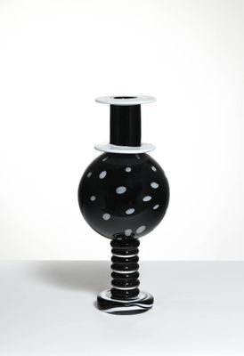 a black and white vase sitting on a table