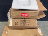 a pile of boxes with a sink on top of it