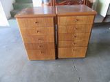 two wooden dressers sitting next to each other in a room