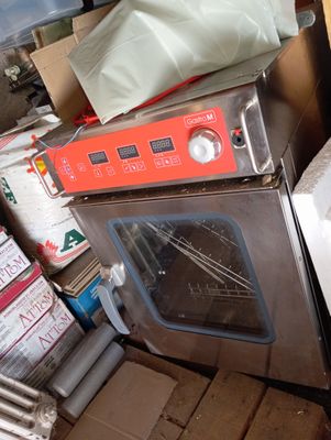 an image of a kitchen with a stove and a lot of boxes