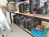 many suitcases on a shelf in a room