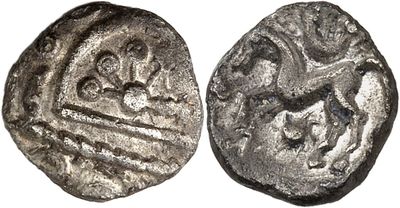 a close up of a silver coin with an image of a man on a horse