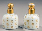 pair of antique glass perfume bottles with gold stars on them