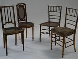 three chairs with a brown seat and a black seat and a white background