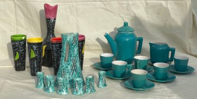 a lot of teapots and cups on a table