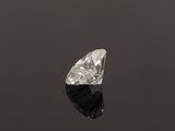 a diamond cut diamond on a black surface
