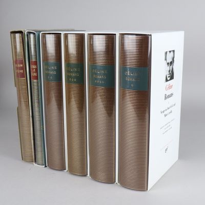three books are stacked on top of each other on a table