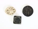 three different types of coins are shown on a white surface