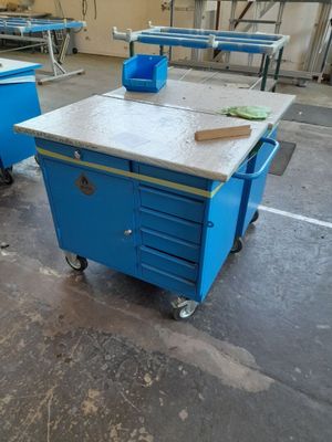 two blue carts that are sitting in a room