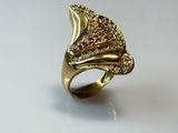 an image of a gold ring with red and white diamonds on it