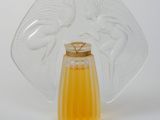 a glass vase with a yellow liquid inside of it