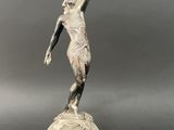 an image of a statue of a woman on a ball