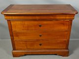 an image of a wooden chest of drawers with three drawers