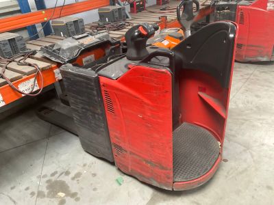 a forklift with a red seat in a warehouse
