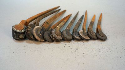 many different types of hammers on a white surface