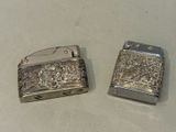two lighters that are sitting next to each other