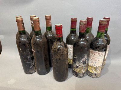 several bottles of wine are lined up in a row on a table