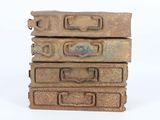 several pieces of luggage stacked on top of each other on a white surface
