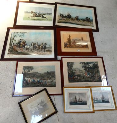 many framed pictures on the floor of a room