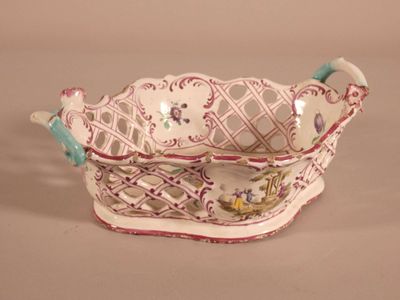 a white and pink bowl with a bird on it