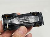 a person holding a black leather belt with a metal buckle