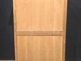 an old wooden cabinet with a marble top on a herringle floor