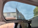 a view of a car ' s rear window from inside the car