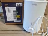 an image of a box with a white humider next to a box with a charger