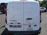 a white van that is parked in a parking lot