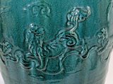 a blue vase with a picture of a man and a woman on it