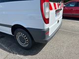 a white van that is parked in a parking lot