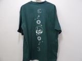 a green t - shirt with a drawing of planets and stars on it