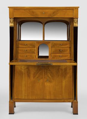 a wooden cabinet with a mirror on top of it