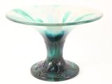 a glass bowl with a green and white design on it