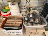 many rolls of tape and rolls of rolls of tape on the counter