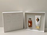 packaging design for a set of perfumes in a white box