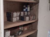 many boxes on the shelves in the room
