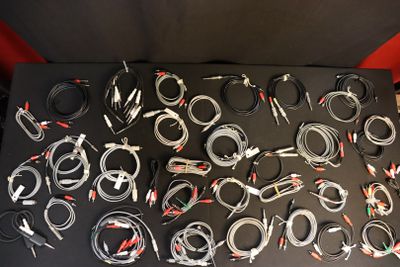 a lot of cables that are sitting on a table