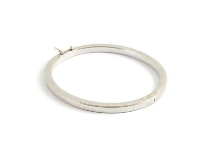 a close up of a silver ring on a white surface