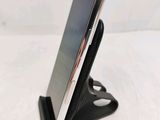 a cell phone that is sitting on top of a stand