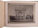 a picture of an old book with a picture of an arch on it
